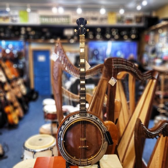 1920s/30s plectrum banjo, substantially built, brass tonering, dowel stick, LH